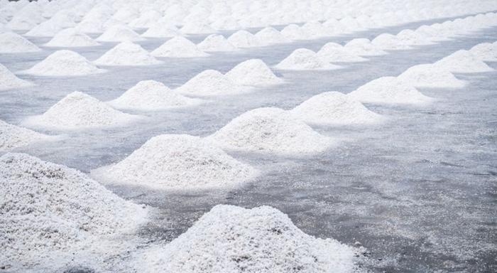 piles-of-white-sea-salt-on-a-grey-floor-m.jpg