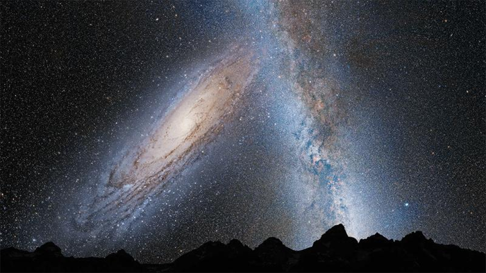 La Via Lattea e Andromeda che collidono in un'immagine di un artista.