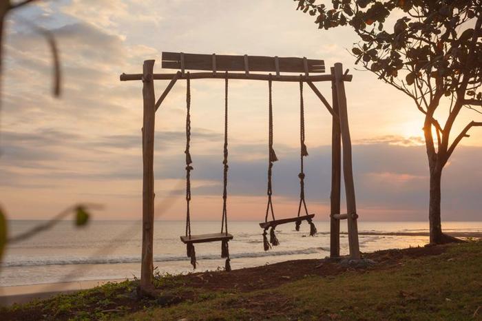 empty-swings-in-front-of-a-sunset-m.jpg