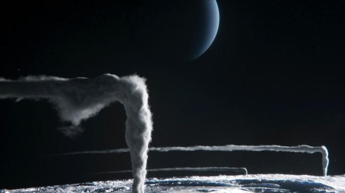 Due pennacchi si alzano nella sottile atmosfera della luna prima di allontanarsi dai venti ad alta quota. Un crescente di Nettuno è visibile sullo sfondo