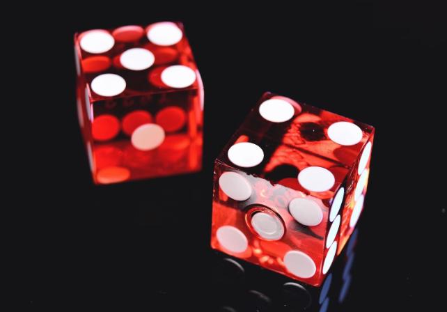 red dice black background